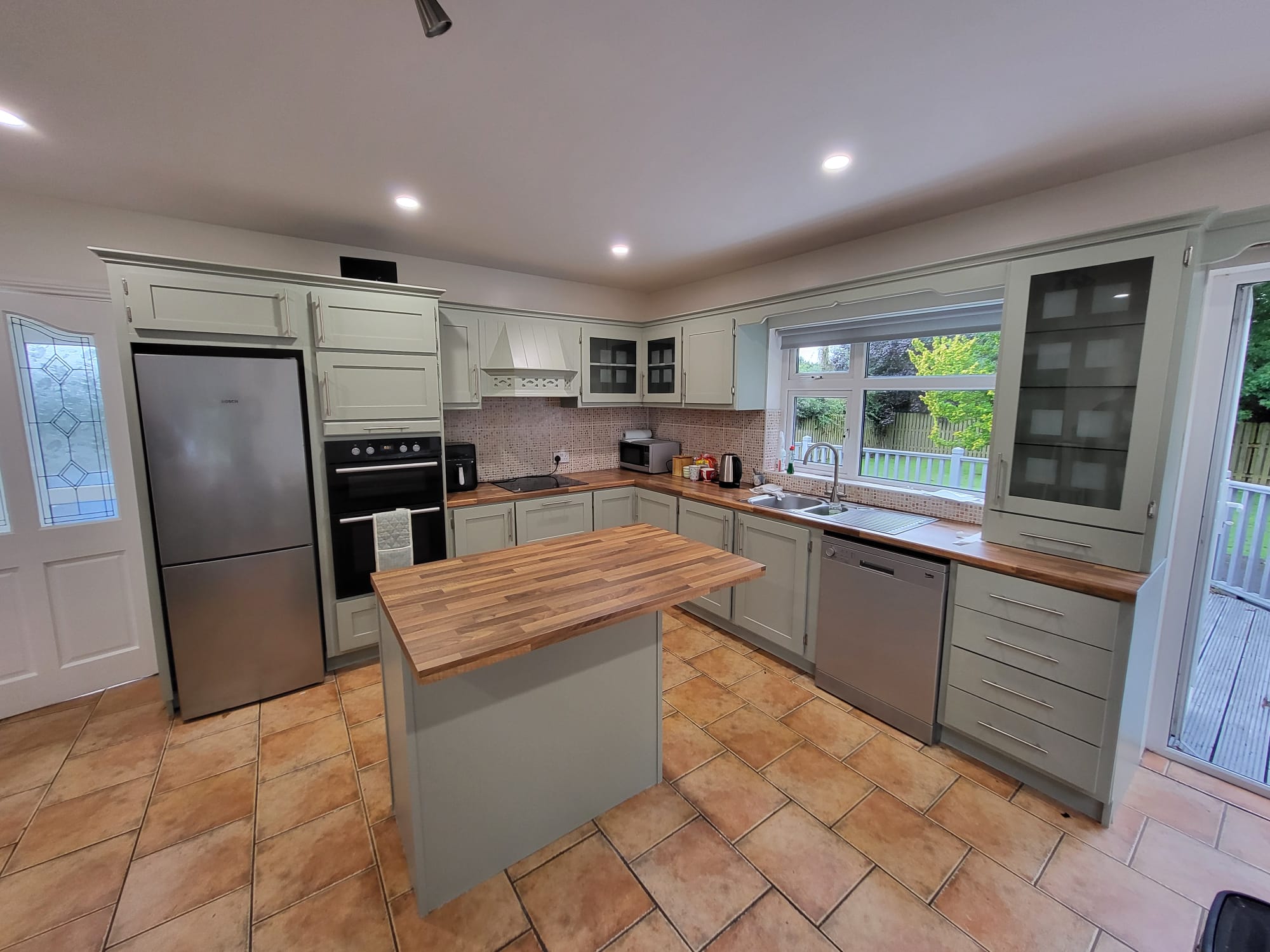 A kitchen that has been spray painted sage green in Co. Wexford